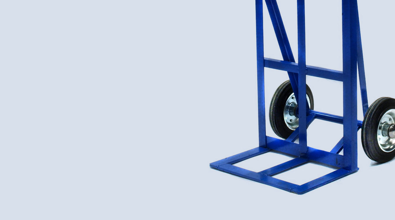 Durable blue hand trolley from Bluetrolley with a solid flat base and large rubber wheels, designed for heavy-duty transport, featured on a light blue background.