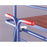 Close-up of a shelf trolley truck with red drawbar handles on a grey background